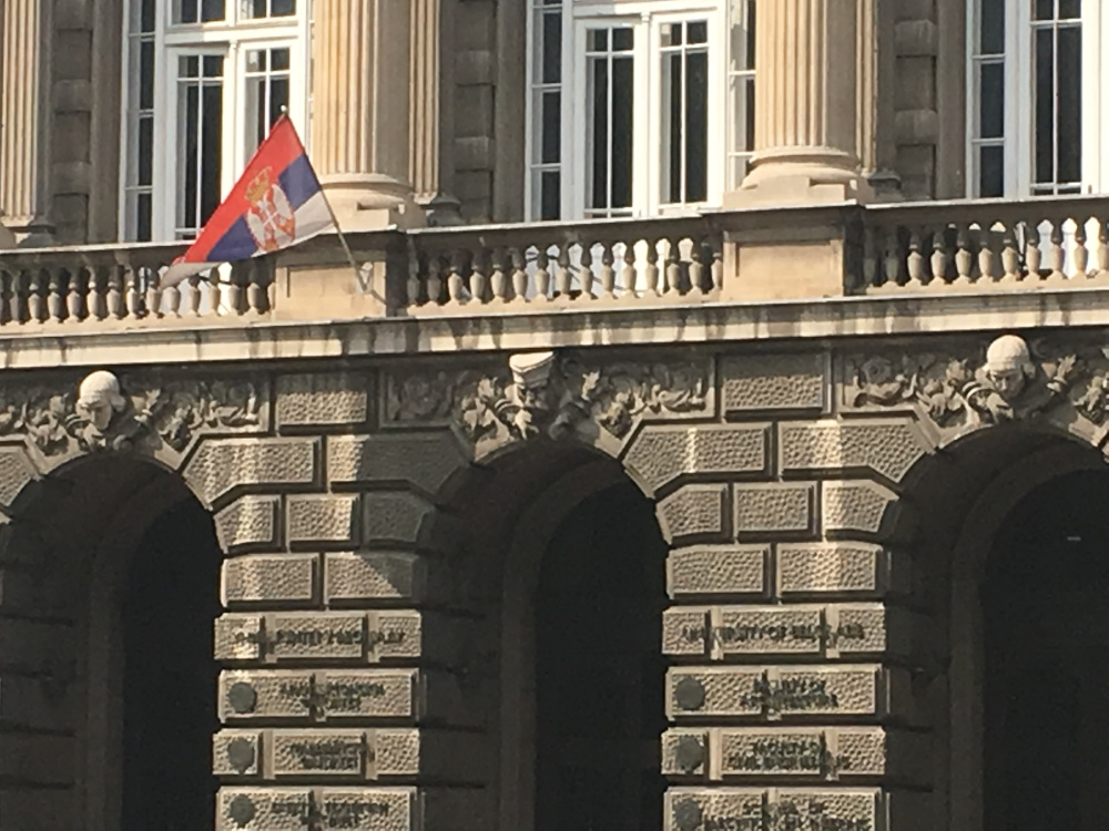 Man wearig "Šajkača" above the main entrance to the Faculty of TechnicalSciences